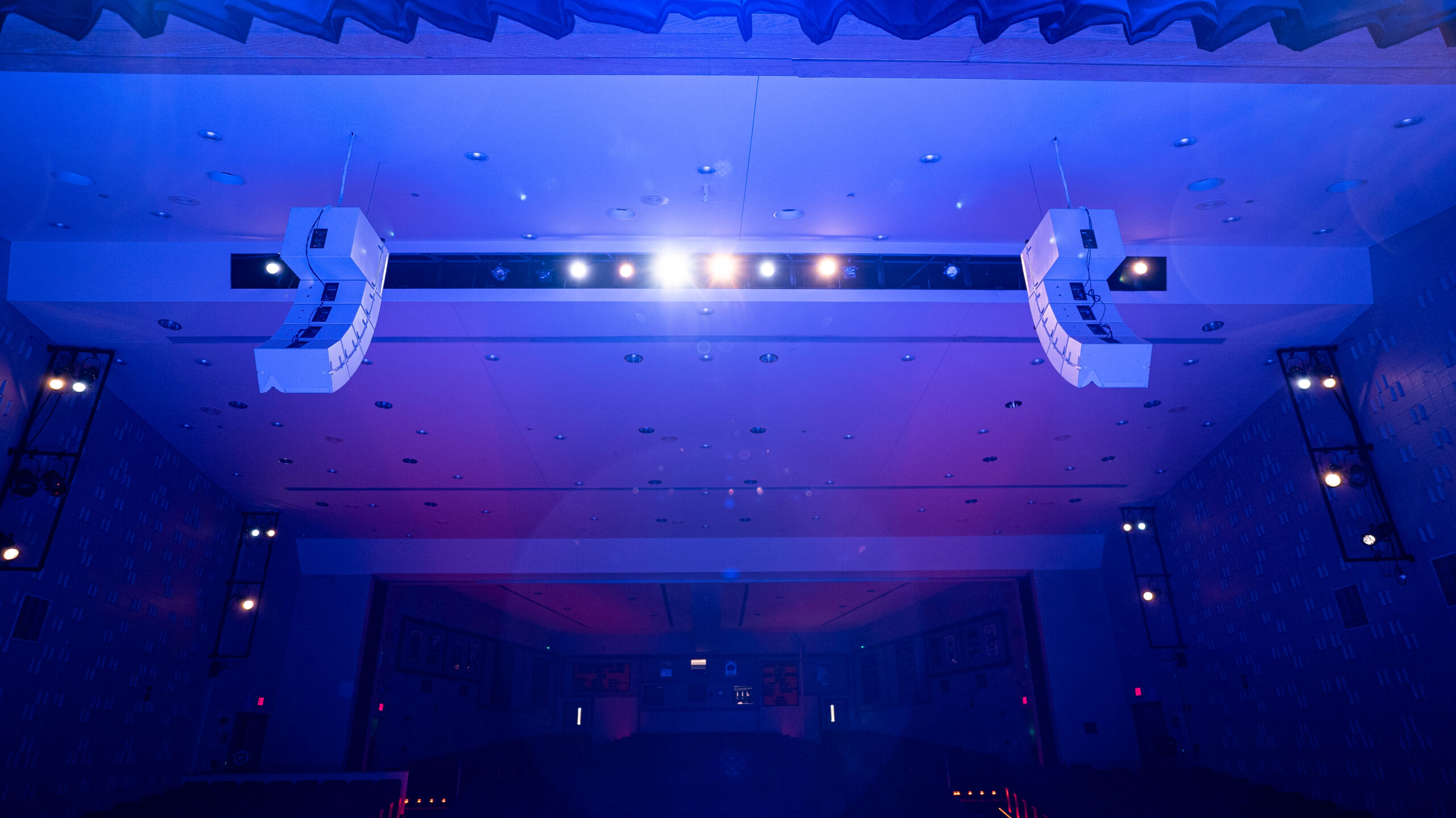 A Stage In A Theatre With Neon Lights.