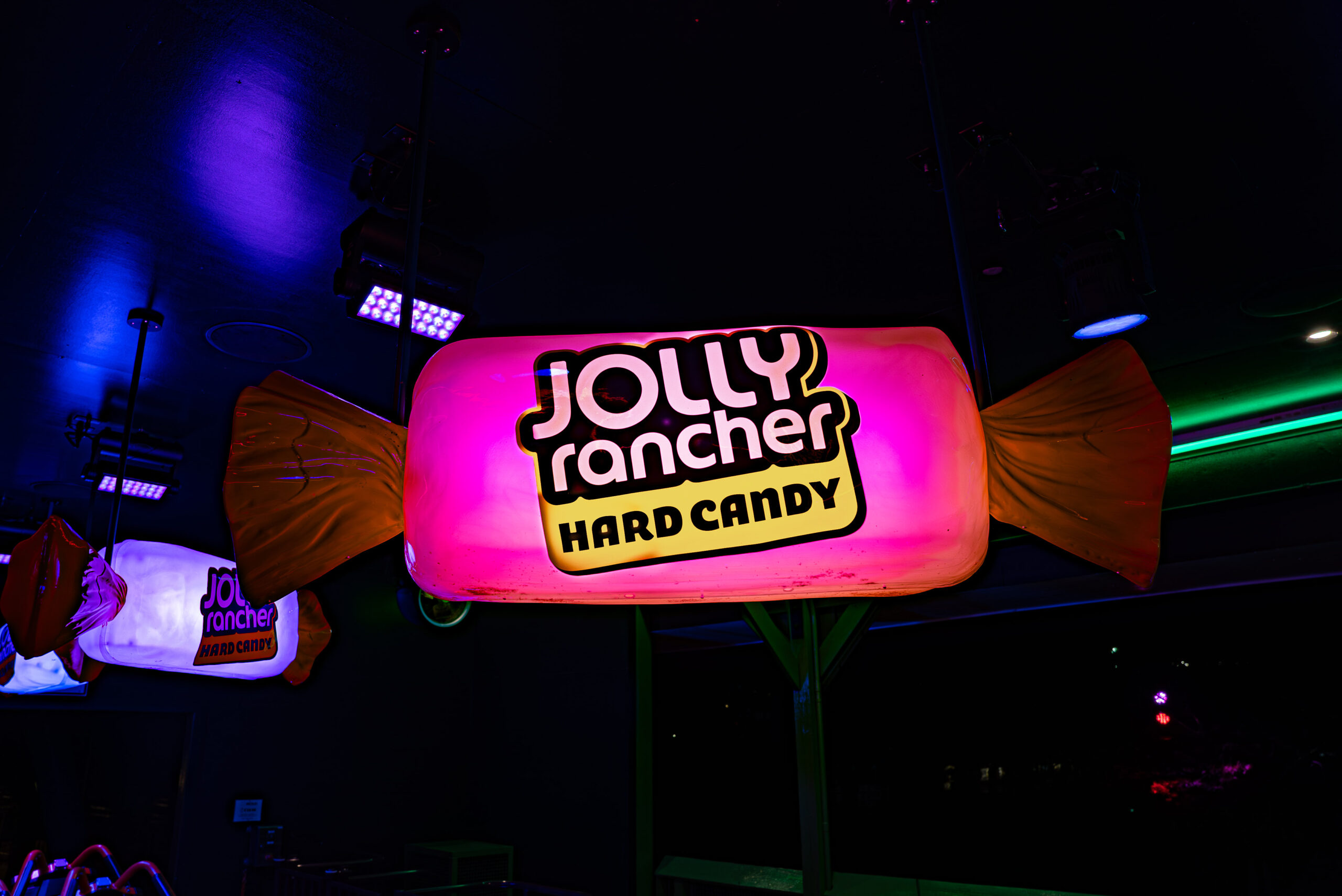 A Pink Neon Light Up Jolly Rancher Decoration.